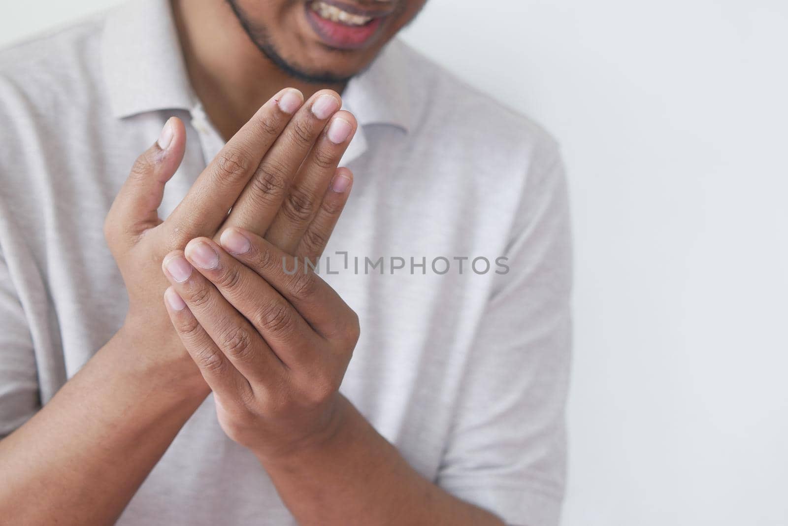 man suffering pain in hand close up .