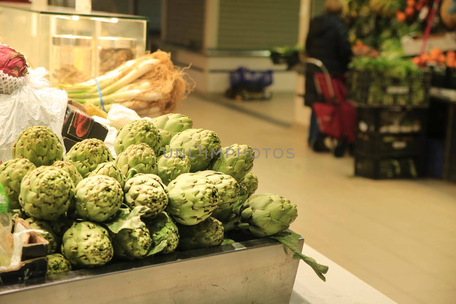 Artichokes for sale at a farmer market stall in the Central Market of Alicante