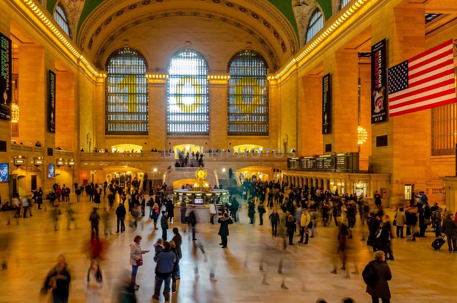 Grand Central Terminal indoors with lots of people walking around, long exposure, illuminated, horizontal