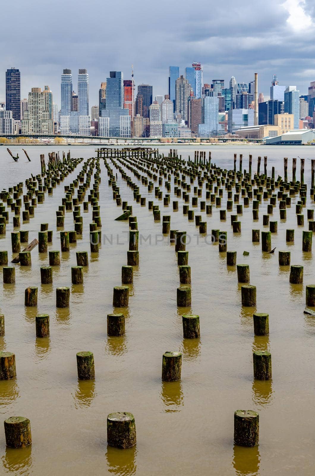 View of Manhattan, New York City with Hudson river and old landing stage in front by bildgigant