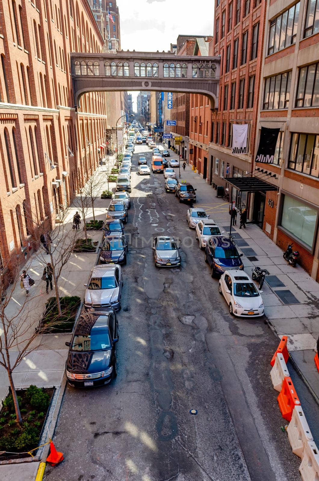 City street with lots of parked Cars in Chelsea, NYC, aerial view from the High Line Rooftop Park by bildgigant