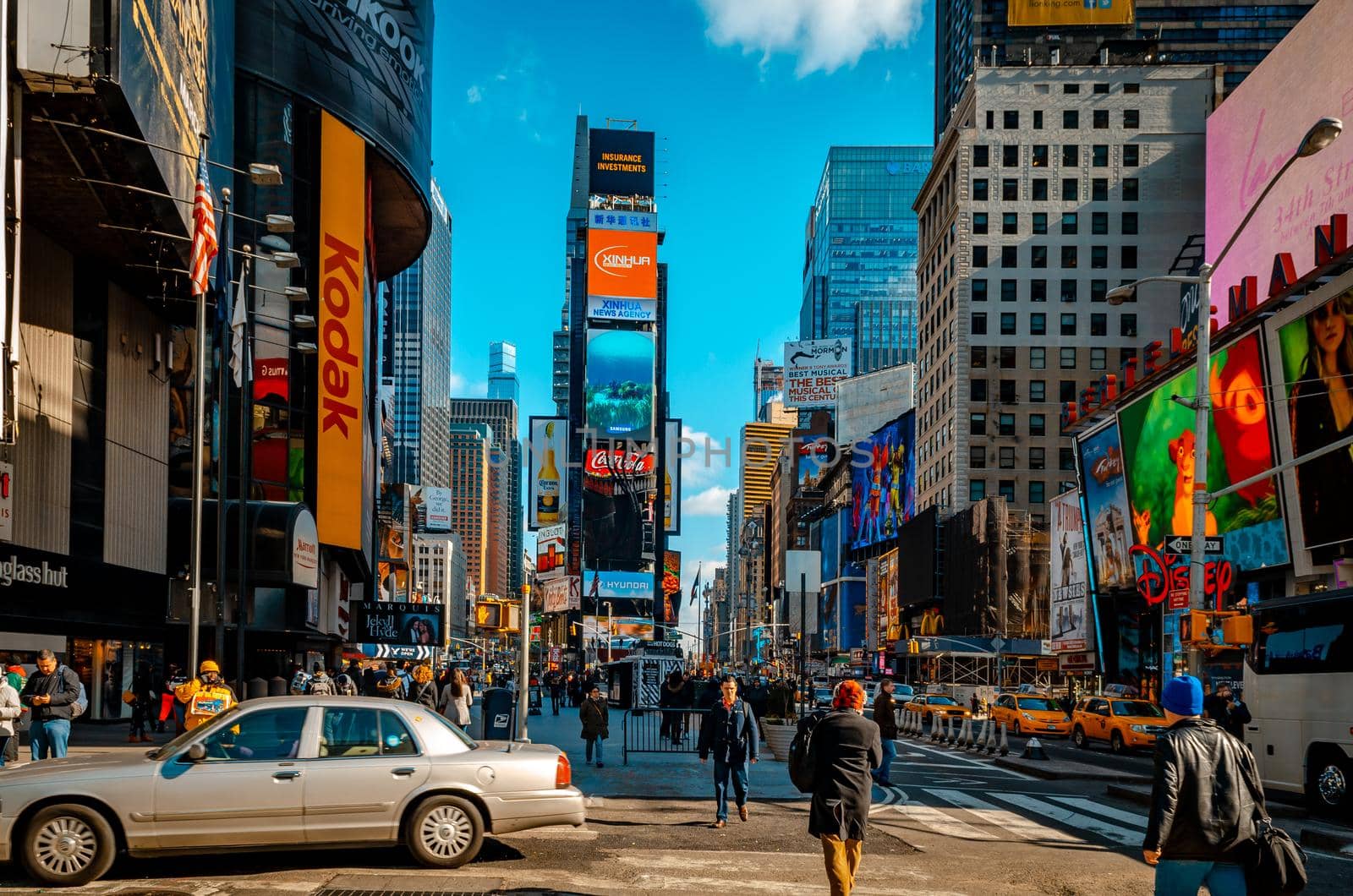 Time Square New York City with lots of Traffic and walking People by bildgigant