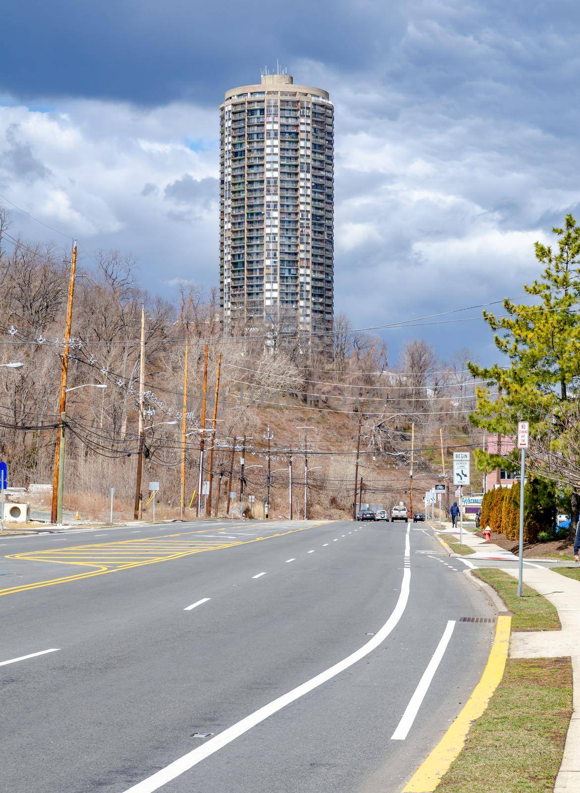 The Stonehenge on the Palisades, Residential Building, Skyscraper at North Bergen, New Jersey  Sky, during overcast on a winter day, view from the distance with city street in the front, vertical