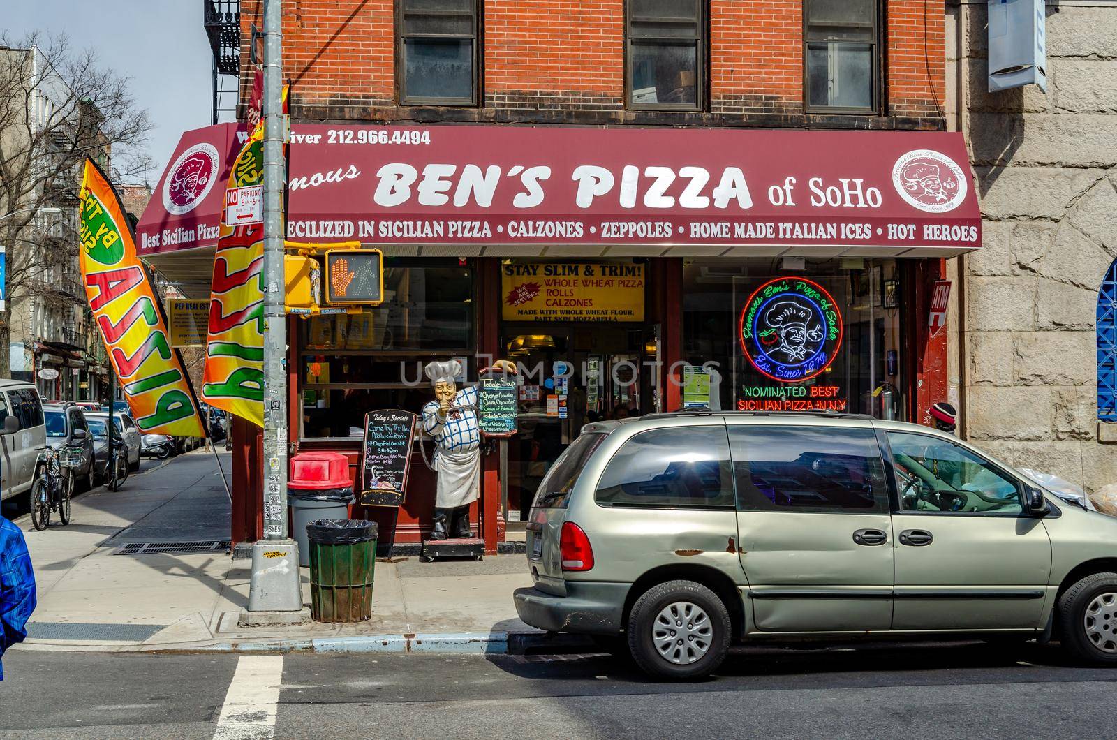 Ben's Pizza of SoHo Italian Restaurant close-up with Car parked in front, New York City during sunny winter day, horizontal