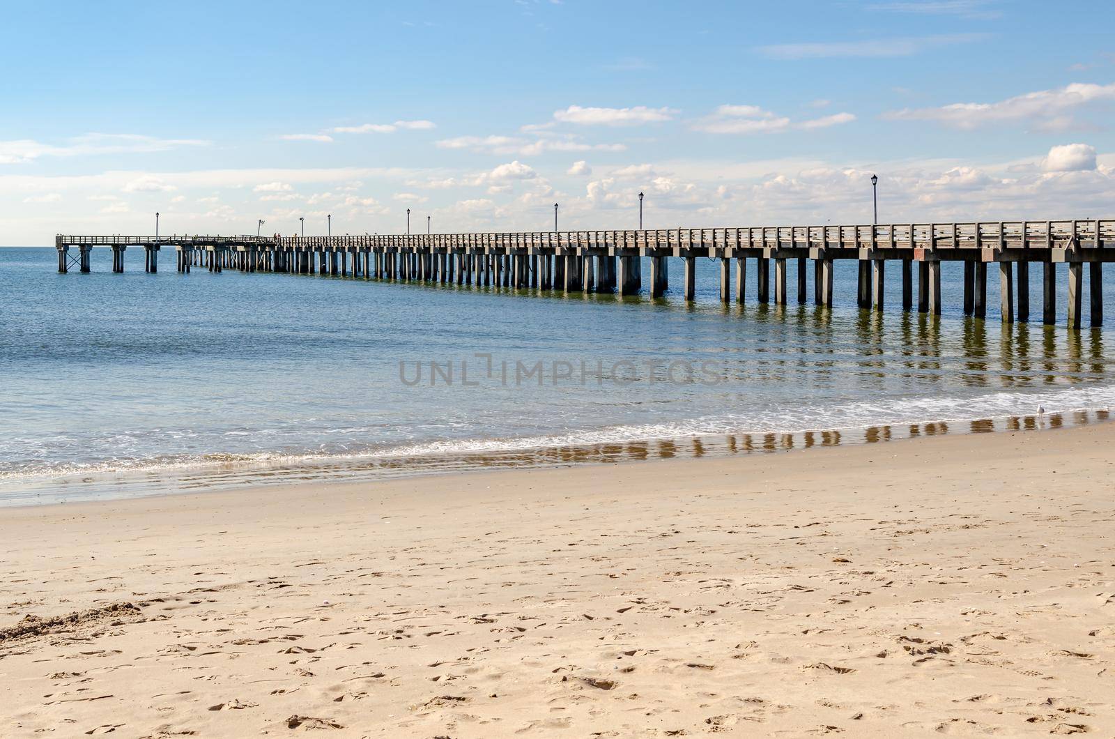 Pat Auletta Steeplechase Pier at Coney island Beach, view from the side, Brooklyn, New York City during winter day with almost clear sky, Ocean in the Background, horizontal