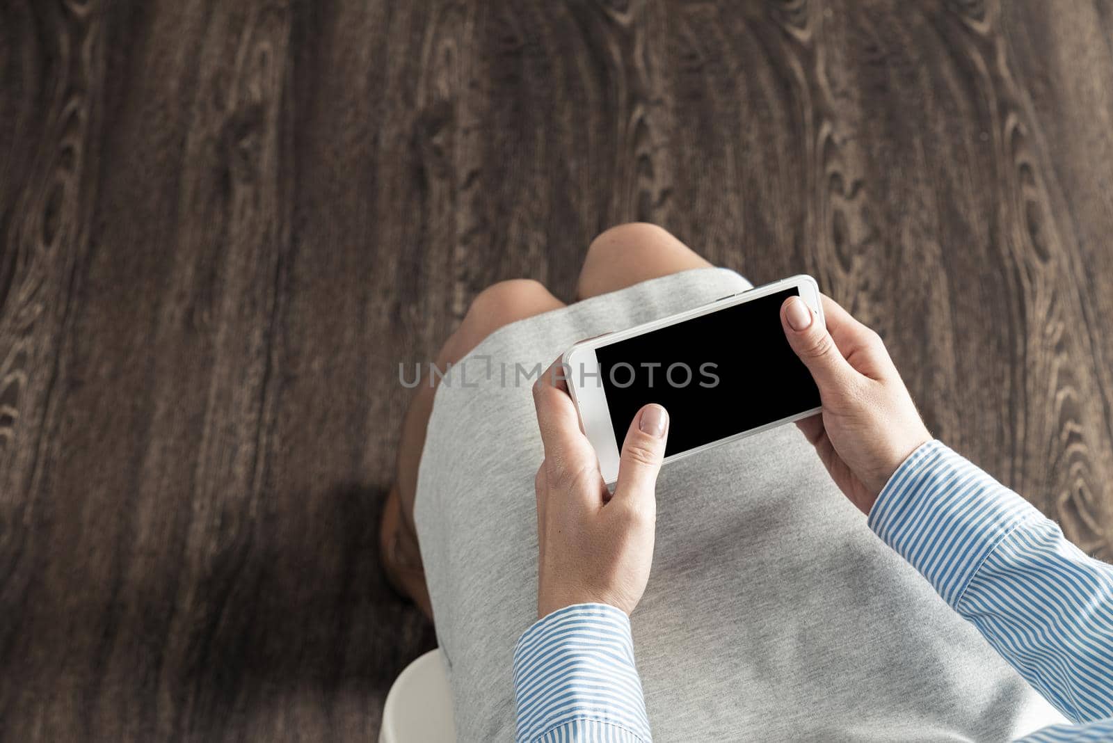 close-up of female hands with a phone