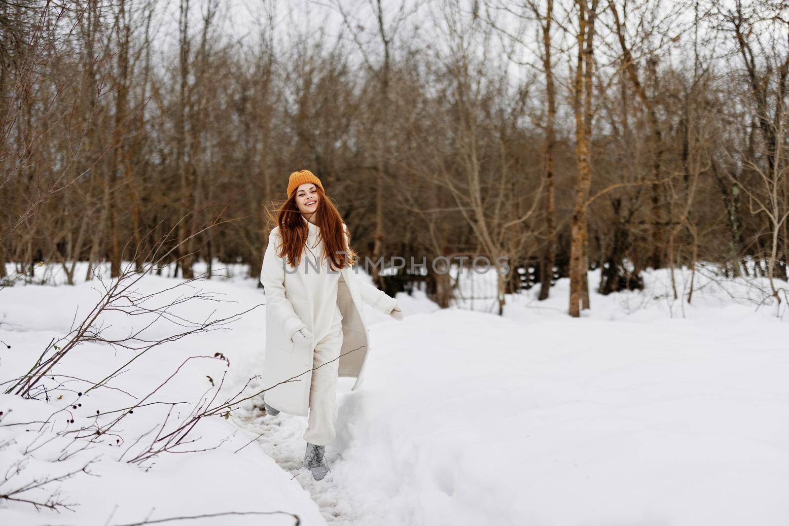 portrait of a woman Walk in winter field landscape outdoor entertainment Lifestyle. High quality photo