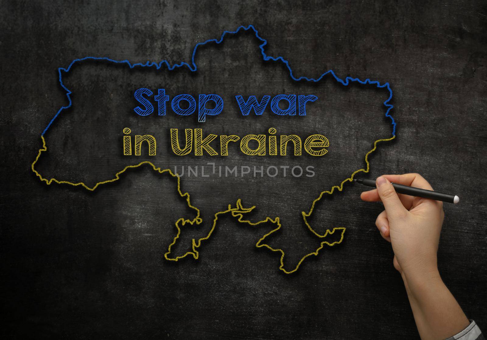 map of Ukraine drawn in chalk on a blackboard with text Stop war in Ukraine. High quality photo