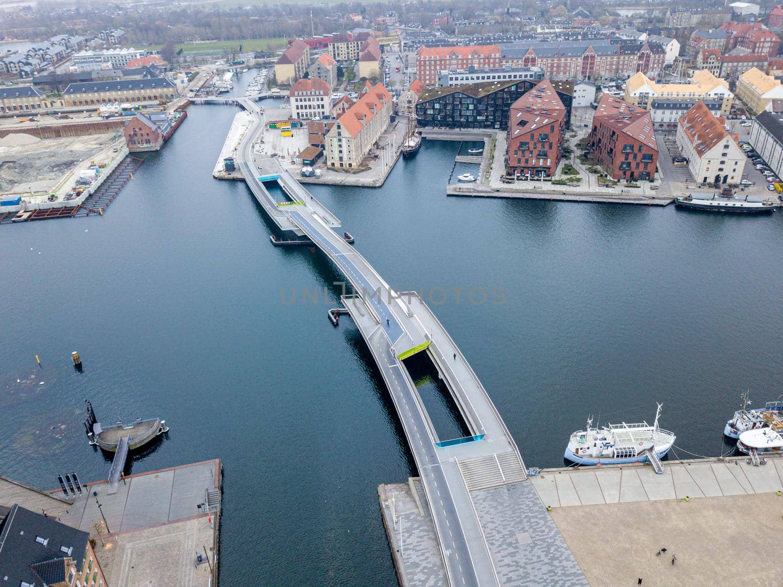 Copenhagen, Denmark - April 7, 2020: Aerial drone view of the modern Inner Harbor Bridge.