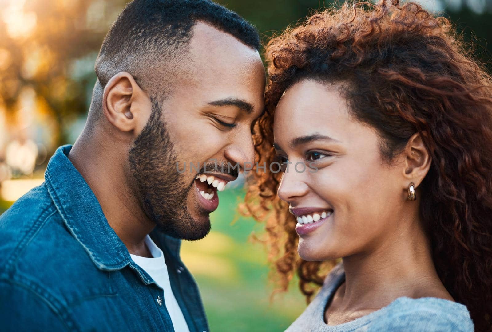 Shot of an affectionate young couple bonding together outdoors.