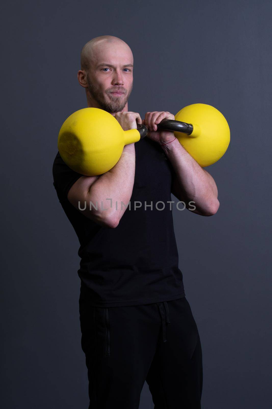 Guy with a yellow kettlebell gym anonymous workout male, for sporty lifestyle from training for up sportive, vietnamese activity. Guy down health, circuit hiit