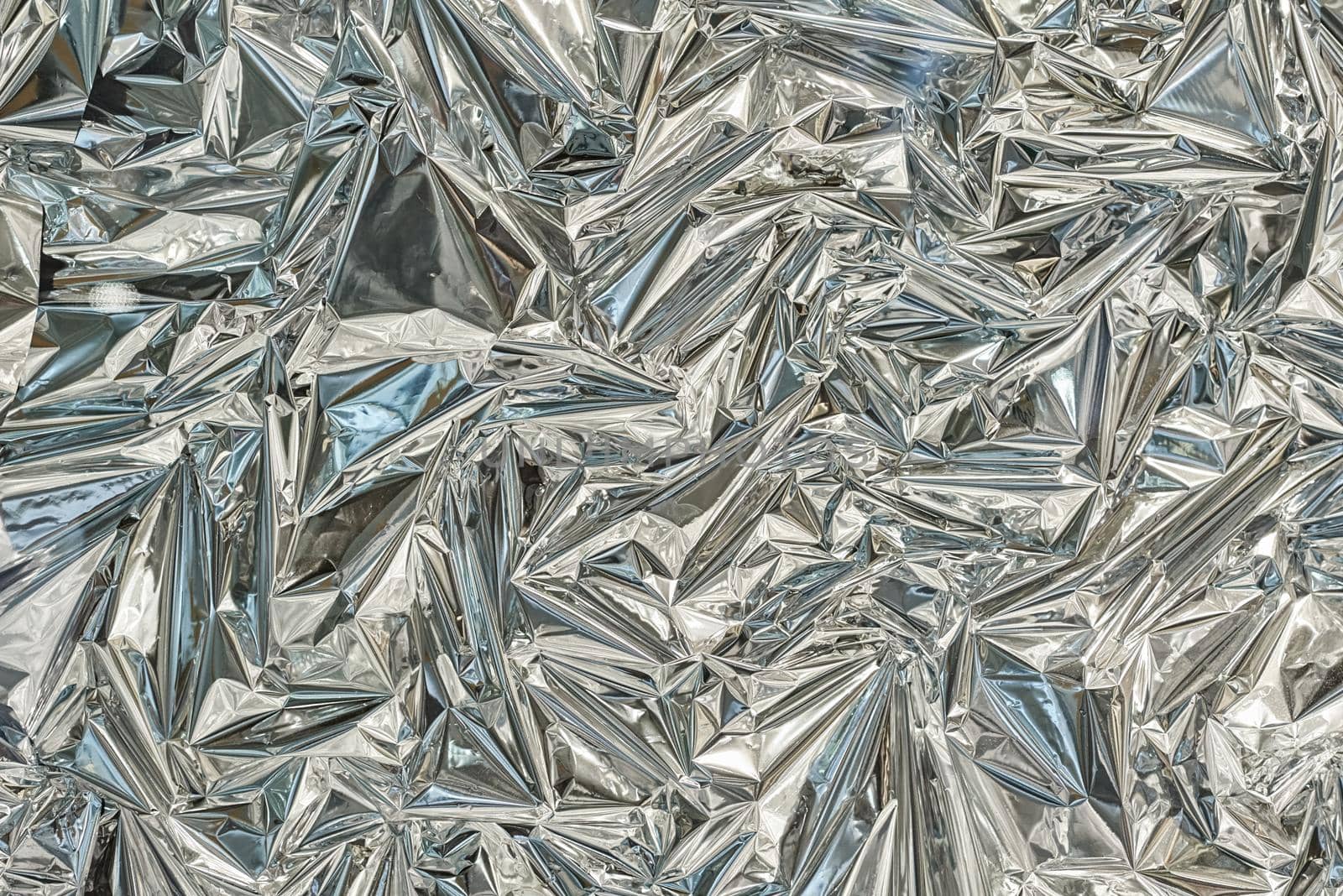 Silver poligonal abctract background. Foil texture background