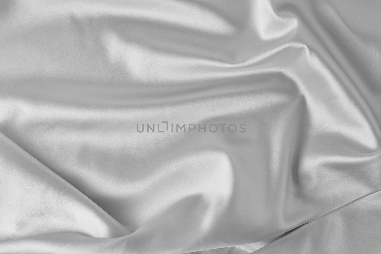 Gray silk background with a folds. Abstract texture of rippled satin surface by Lazy_Bear