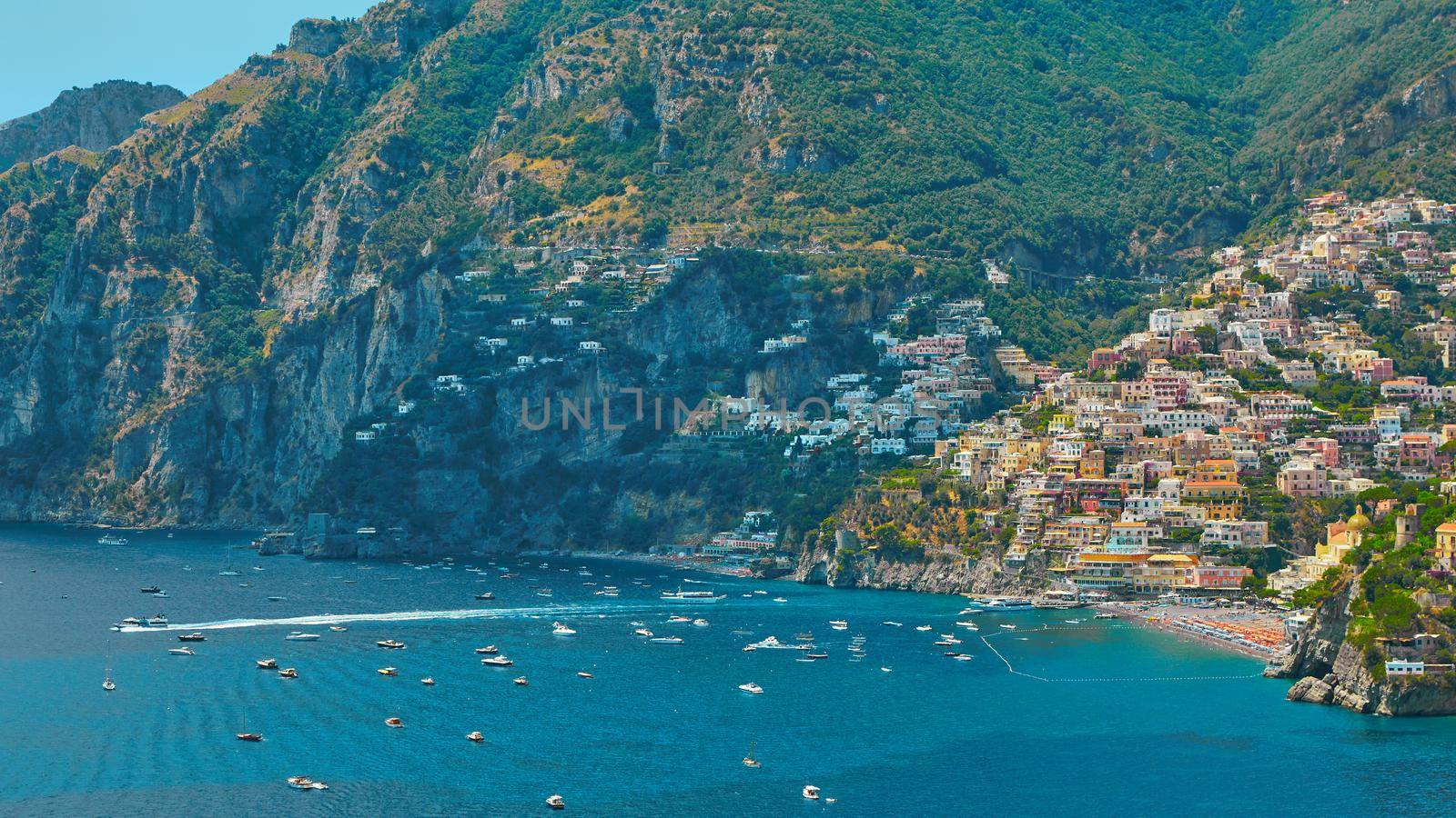 One of the best resorts of Italy with old colorful villas on the steep slope, nice beach, numerous yachts and boats in harbor and medieval towers along the coast, Positano