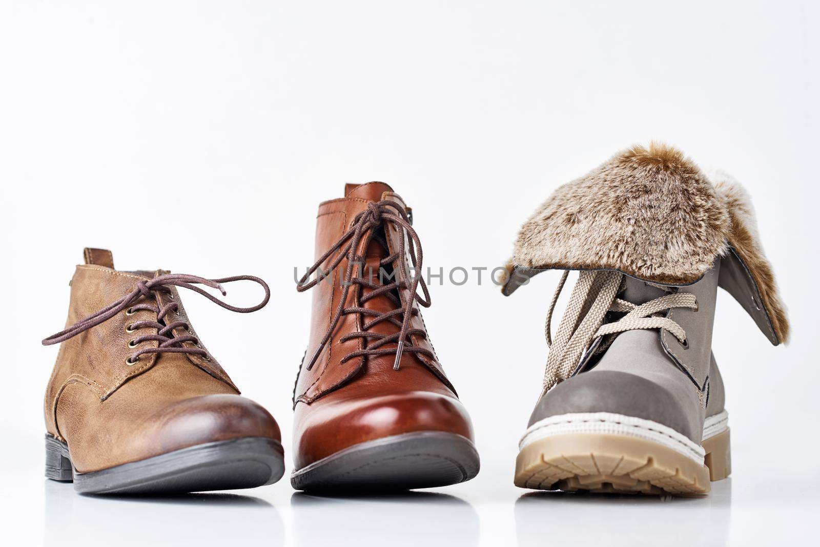 Three different leather womens boots on the white background isolated by Lazy_Bear