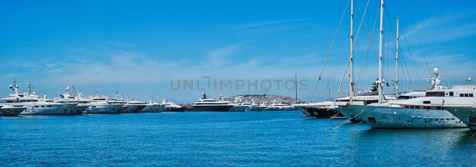 Panorama of moored Yachts and boats on summer day in port of Athens. Athens, Greece