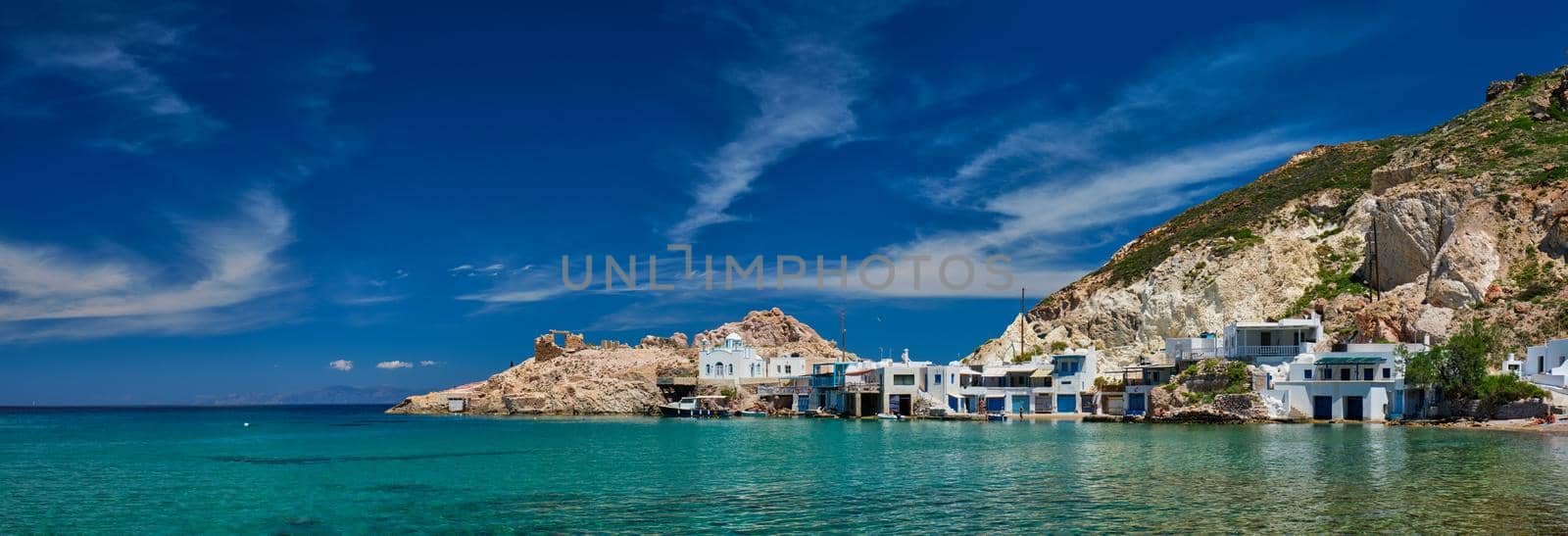 Panorama of the beach and fishing village of Firapotamos in Milos island, Greece