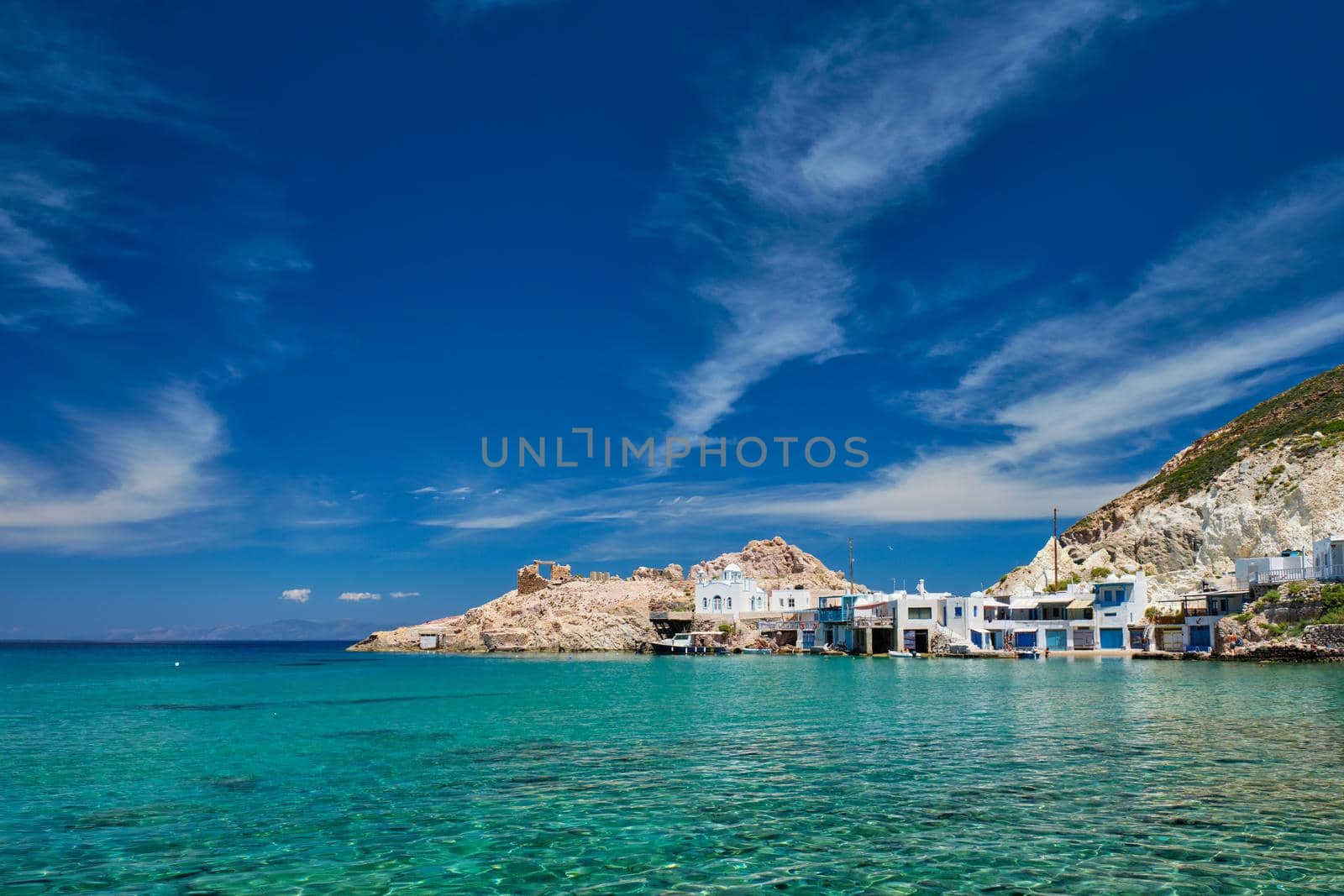 Greek village scenic picturesque view in Greece - the beach and fishing village of Firapotamos in Milos island, Greece