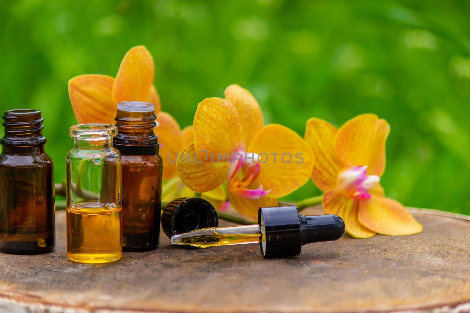 Massage oil and stones with yellow orchid. Natural oils. by Anuta23