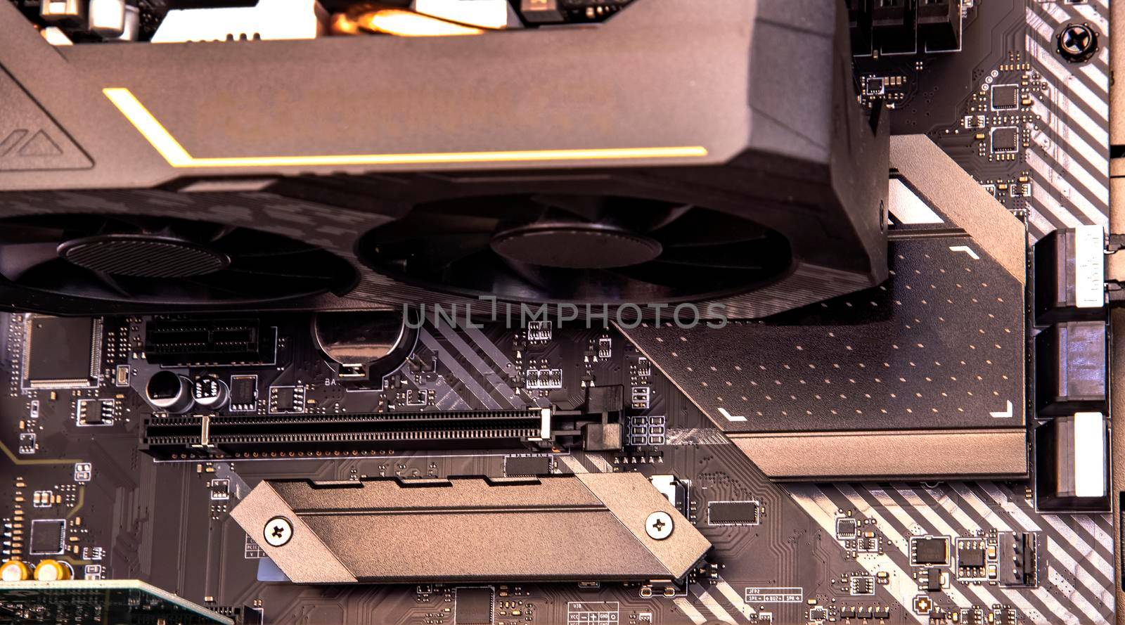 a part of a desktop computer. Video card on motherboard. Close up by EdVal