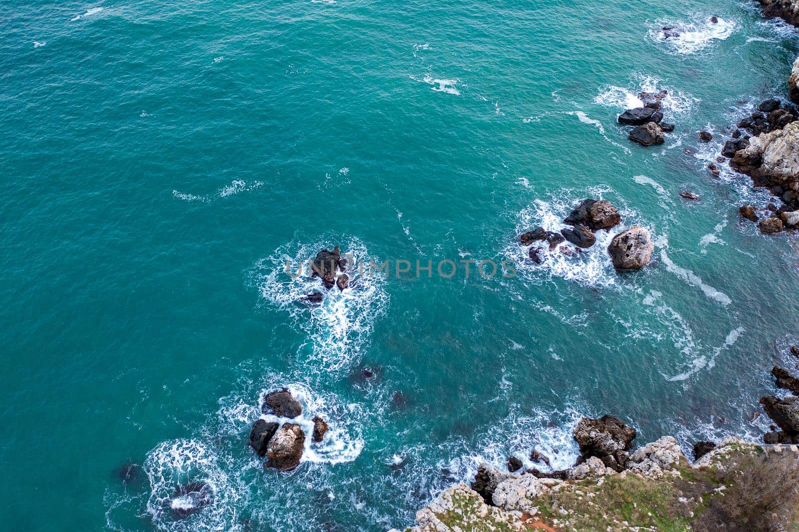 Aerial drone view of many rocks near the shore