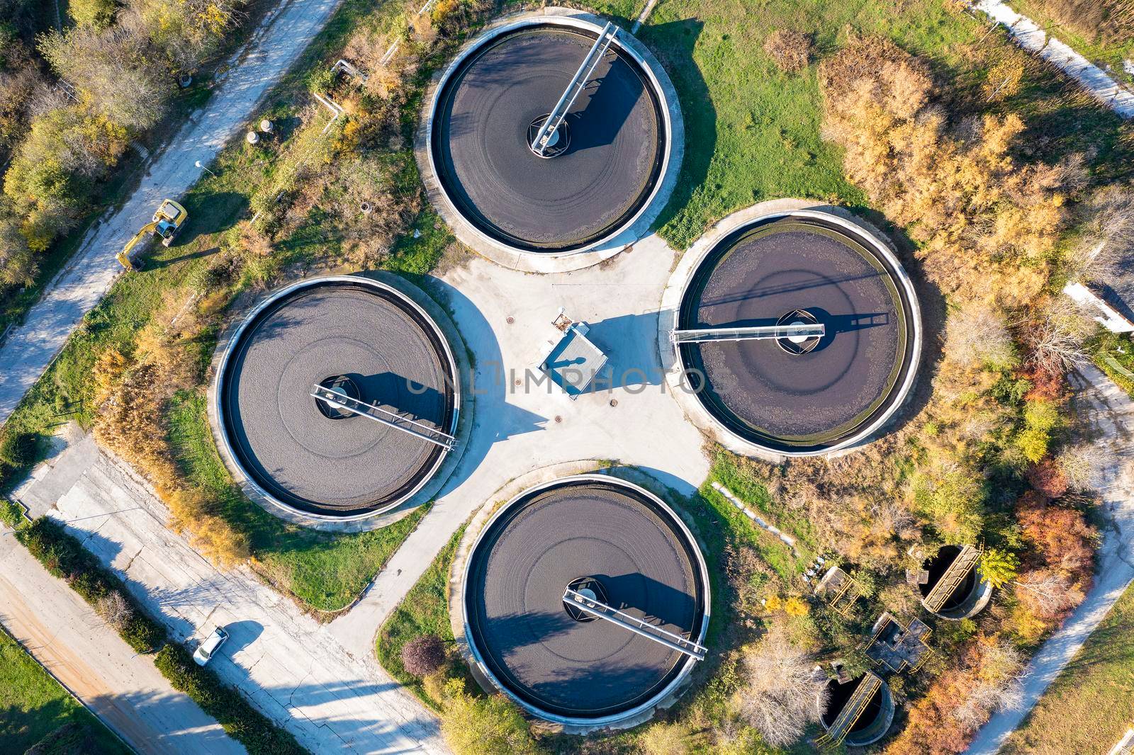 Aerial top view of a sewage treatment plant. A group from the big sedimentation drainage. by EdVal