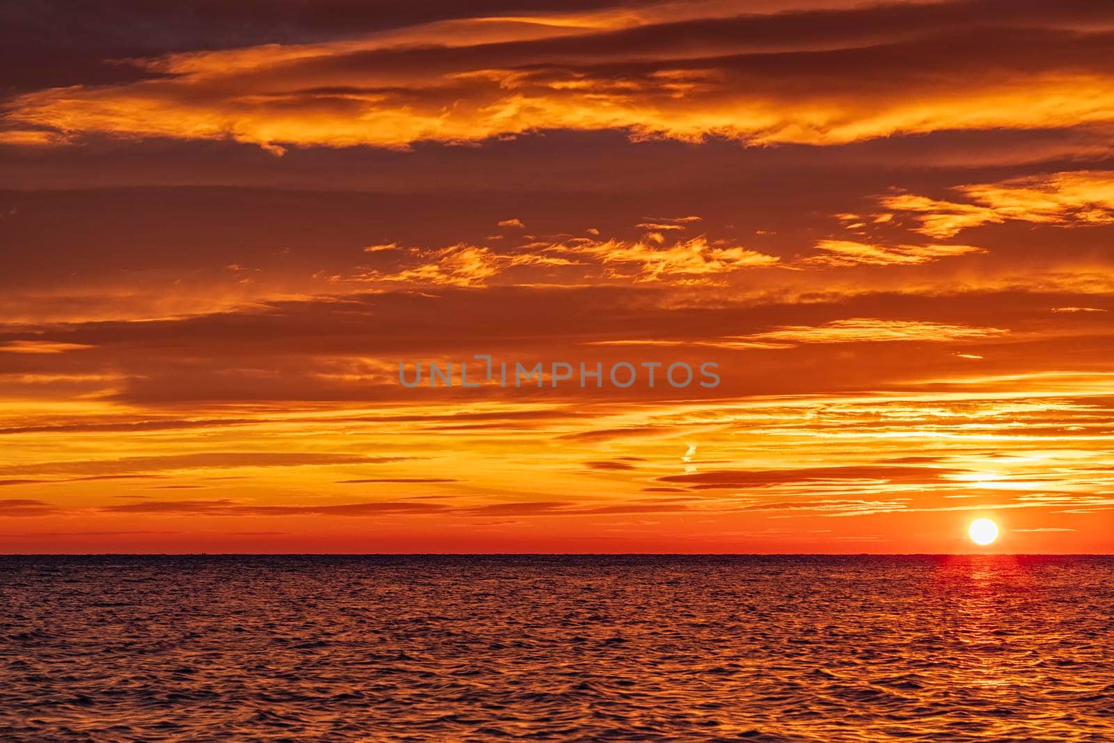 Amazing rising sun at sea horizon