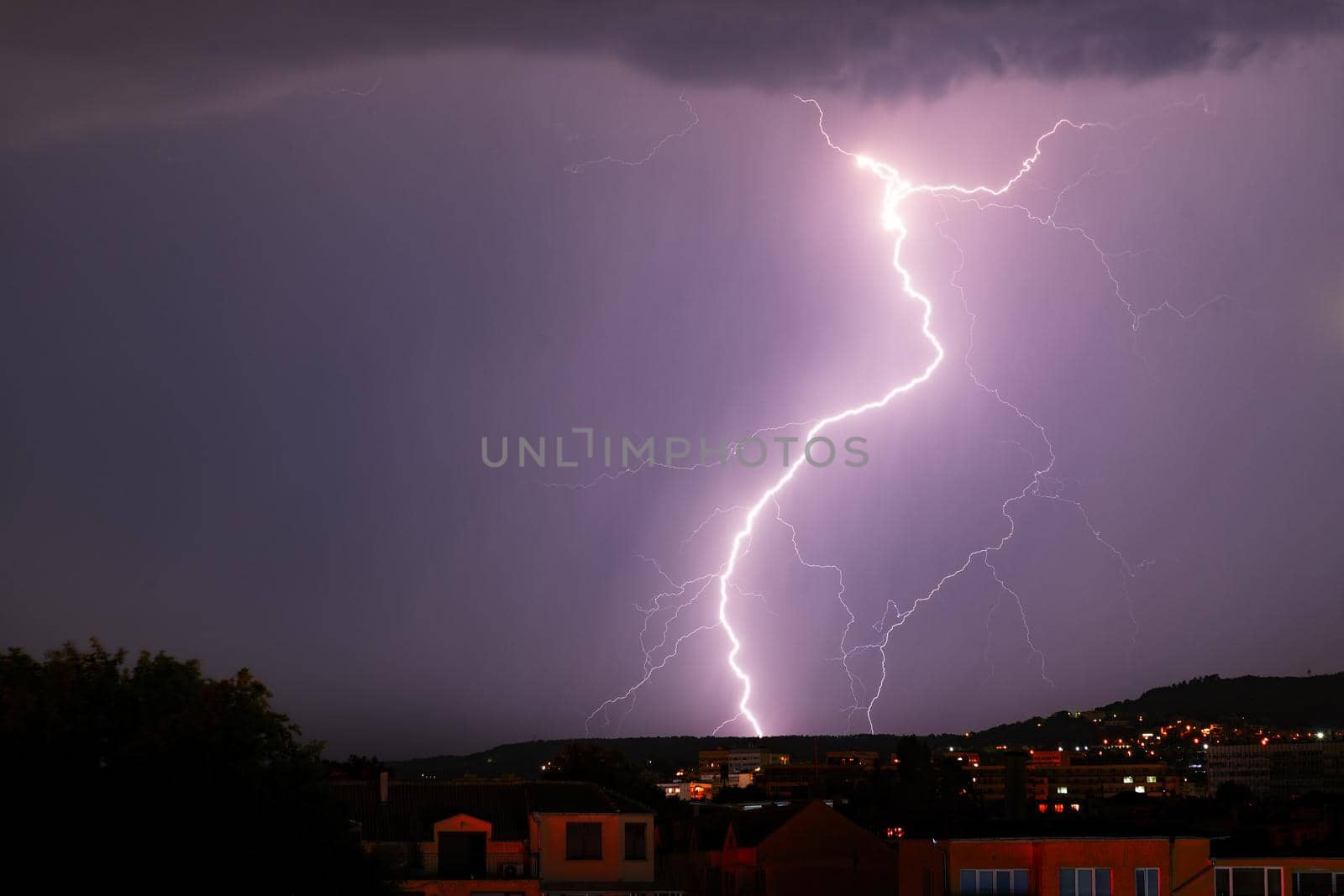 Exciting powerful lightning over the city, zipper and thunderstorm by EdVal