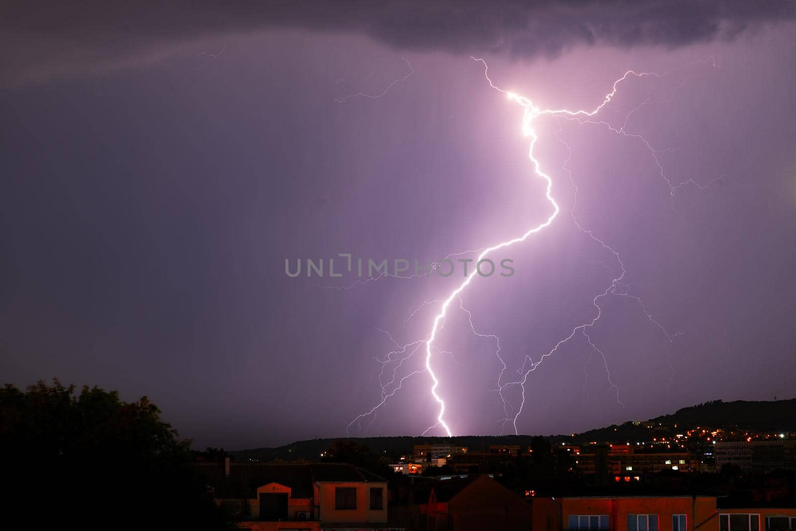 Exciting powerful lightning over the city, zipper and thunderstorm