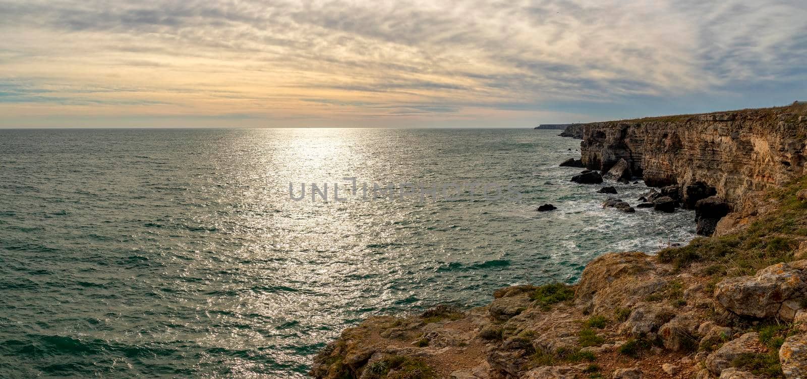 Panoramic seascape with scenic clouds over the sea with big rocks by EdVal