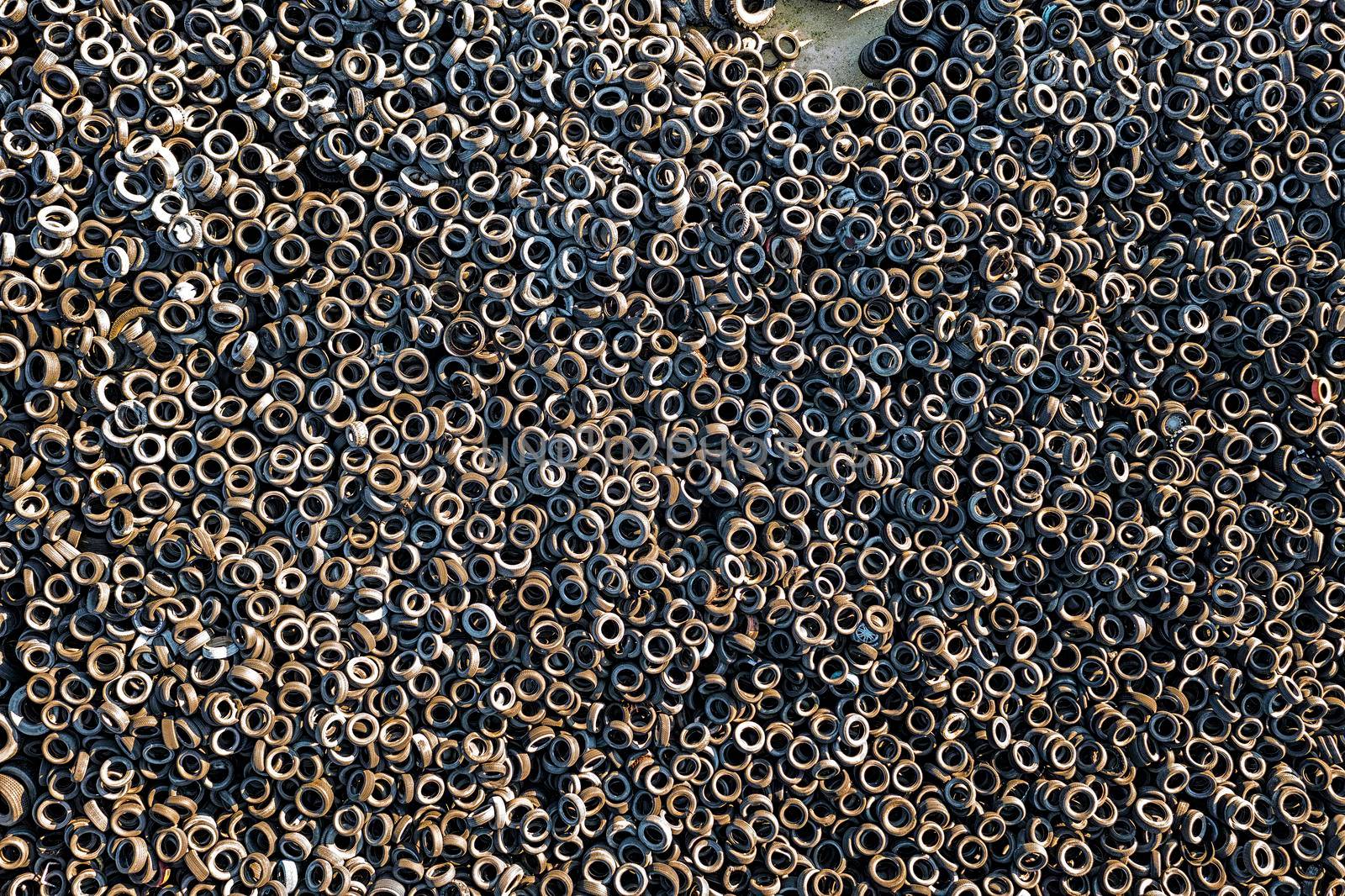 aerial view of many old tires from used cars. Environmental pollution. Dump tires