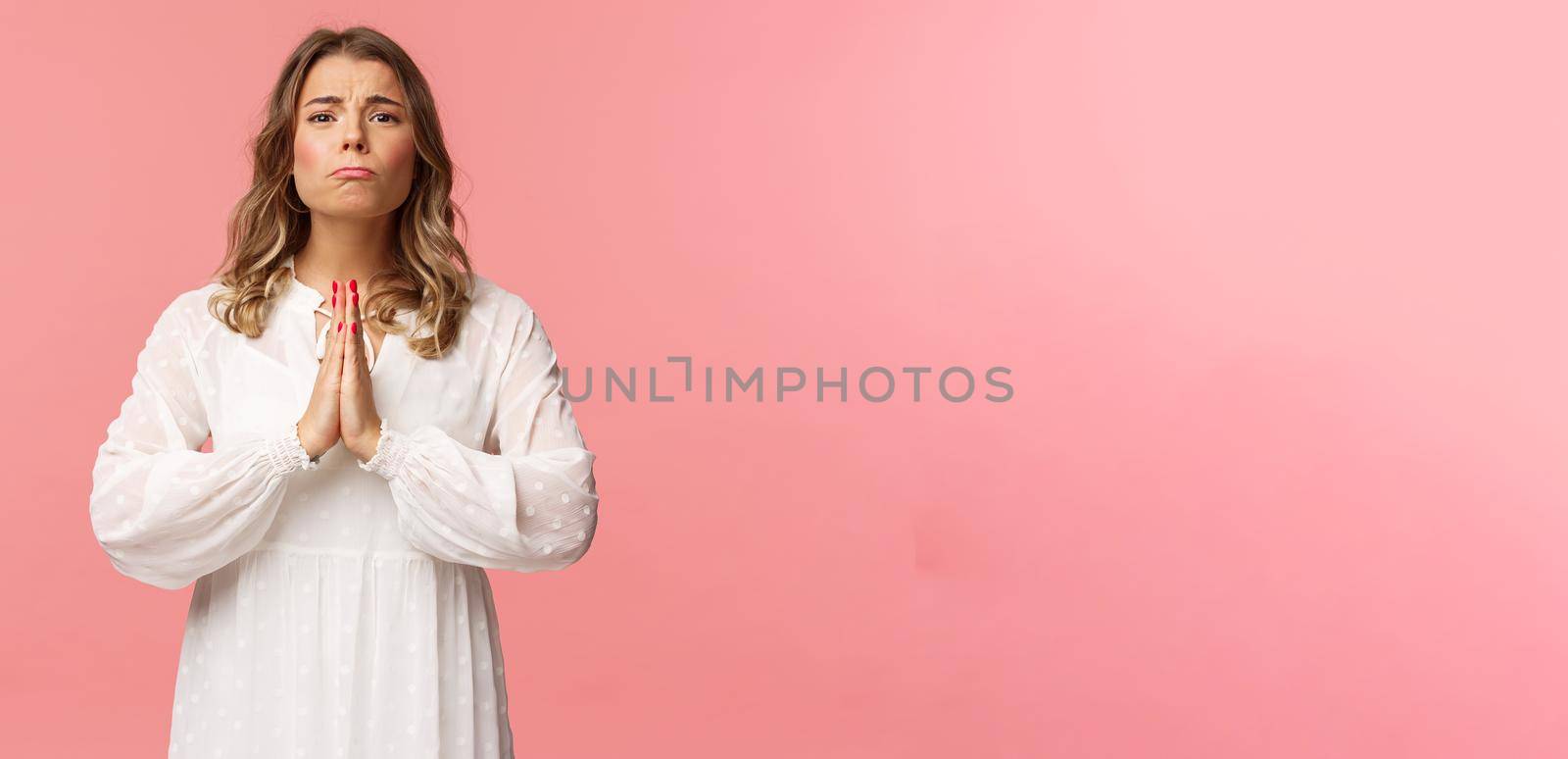 Portrait of hopeful clingy girlfriend, blond girl begging for favour in white dress over pink background, sobbing make cute eyes, pleading or praying, say please, want something badly by Benzoix