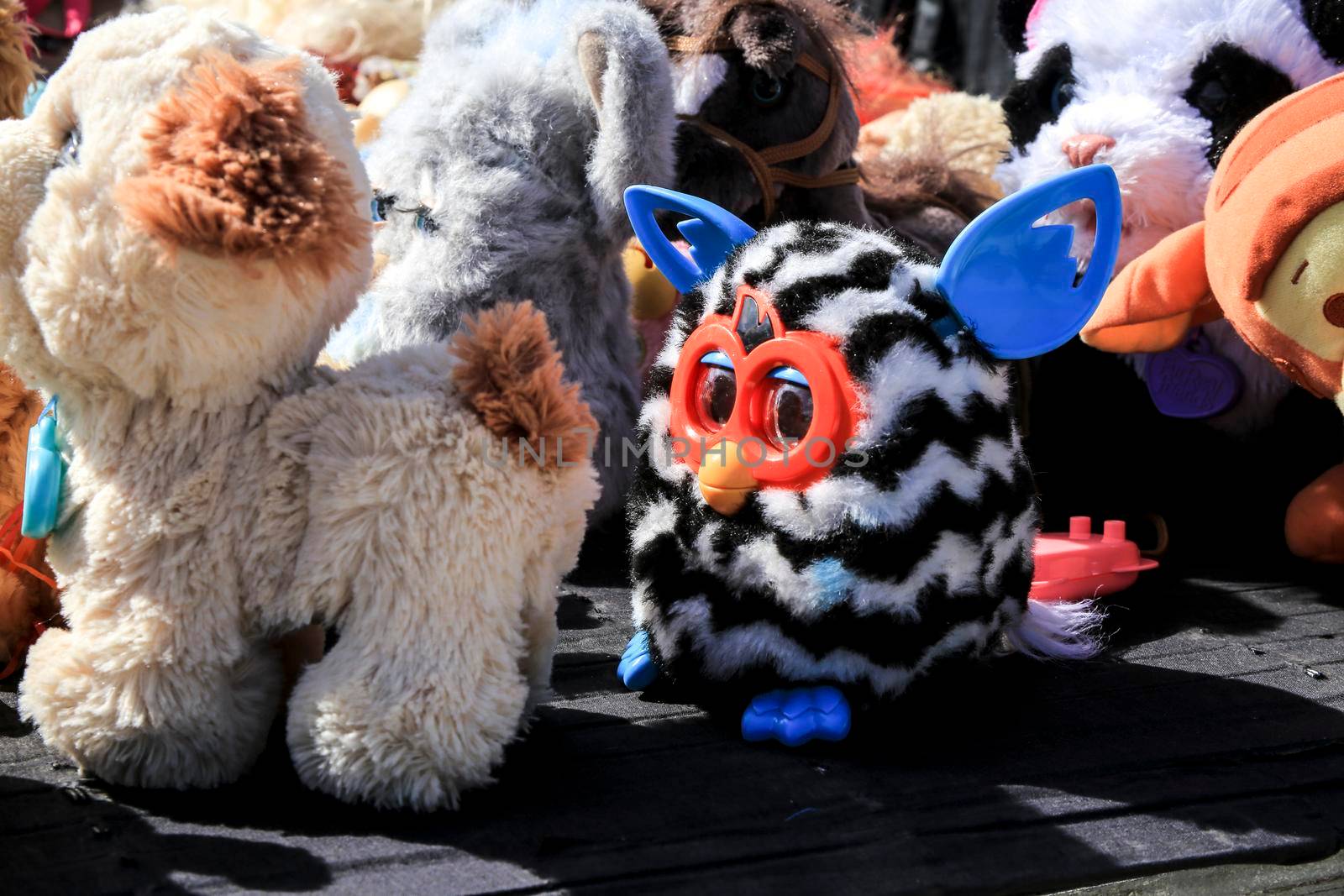 Guardamar, Alicante, Spain- April 3, 2022: Second hand stuffed animals for sale at a market stall