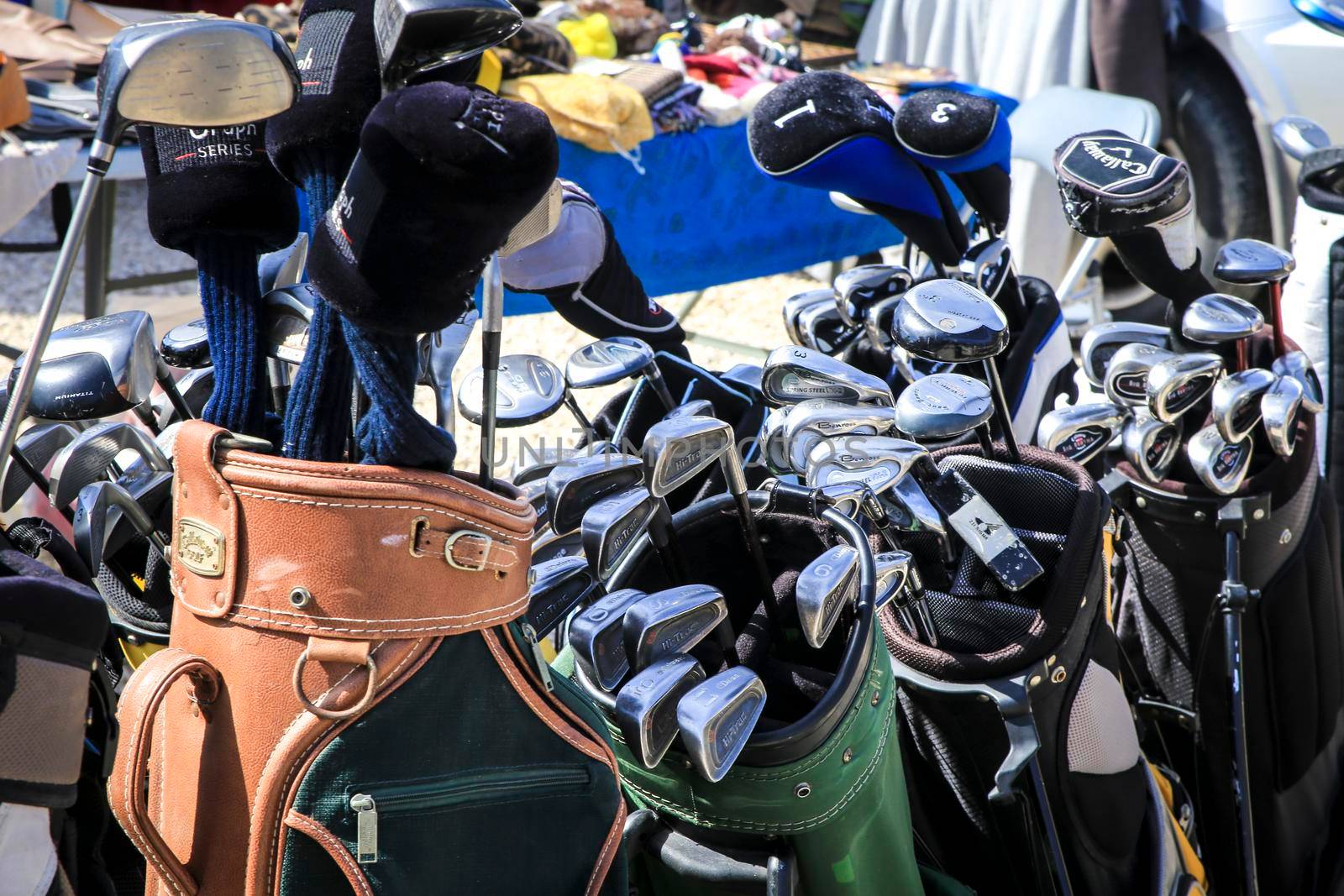 Guardamar, Alicante, Spain- April 3, 2022: Second hand golf clubs for sale in El Fogon Antique Flea Market