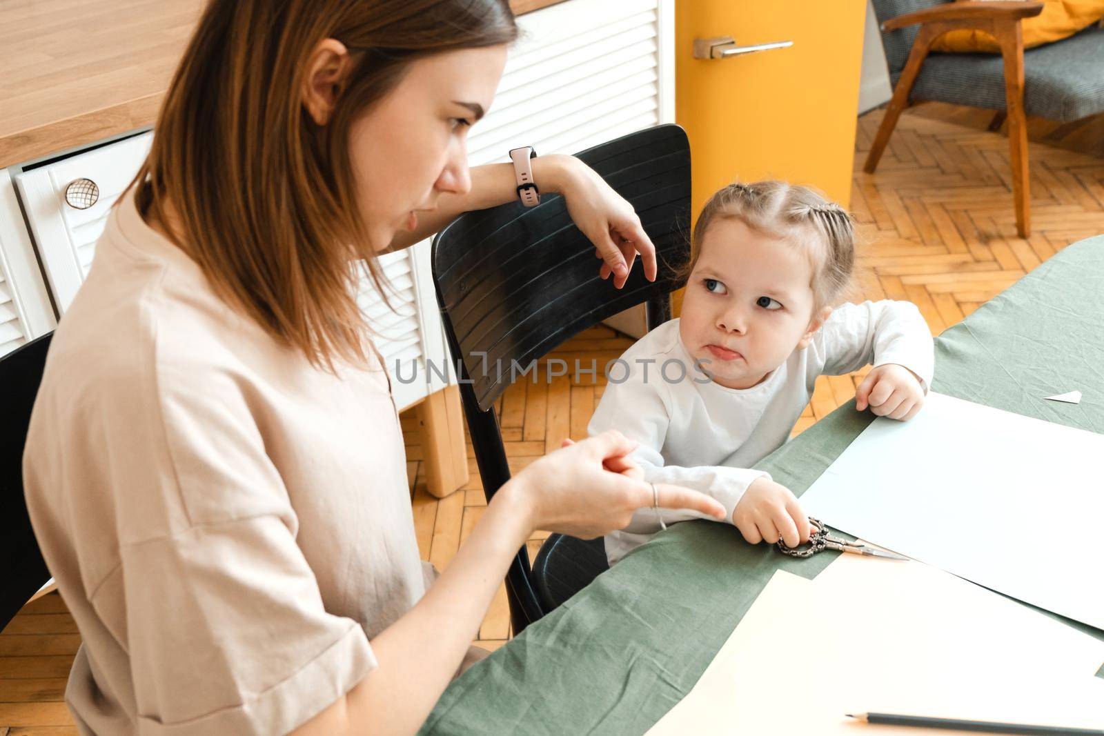 Irritated mother explaining learning material to stressed unhappy preschooler girl, scolding lazy daughter for bad results, scolding for problems in kindergarten by etonastenka