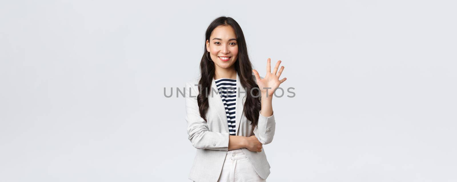 Business, finance and employment, female successful entrepreneurs concept. Successful female businesswoman, asian real estate broker pointing finger, showing number five and smiling by Benzoix