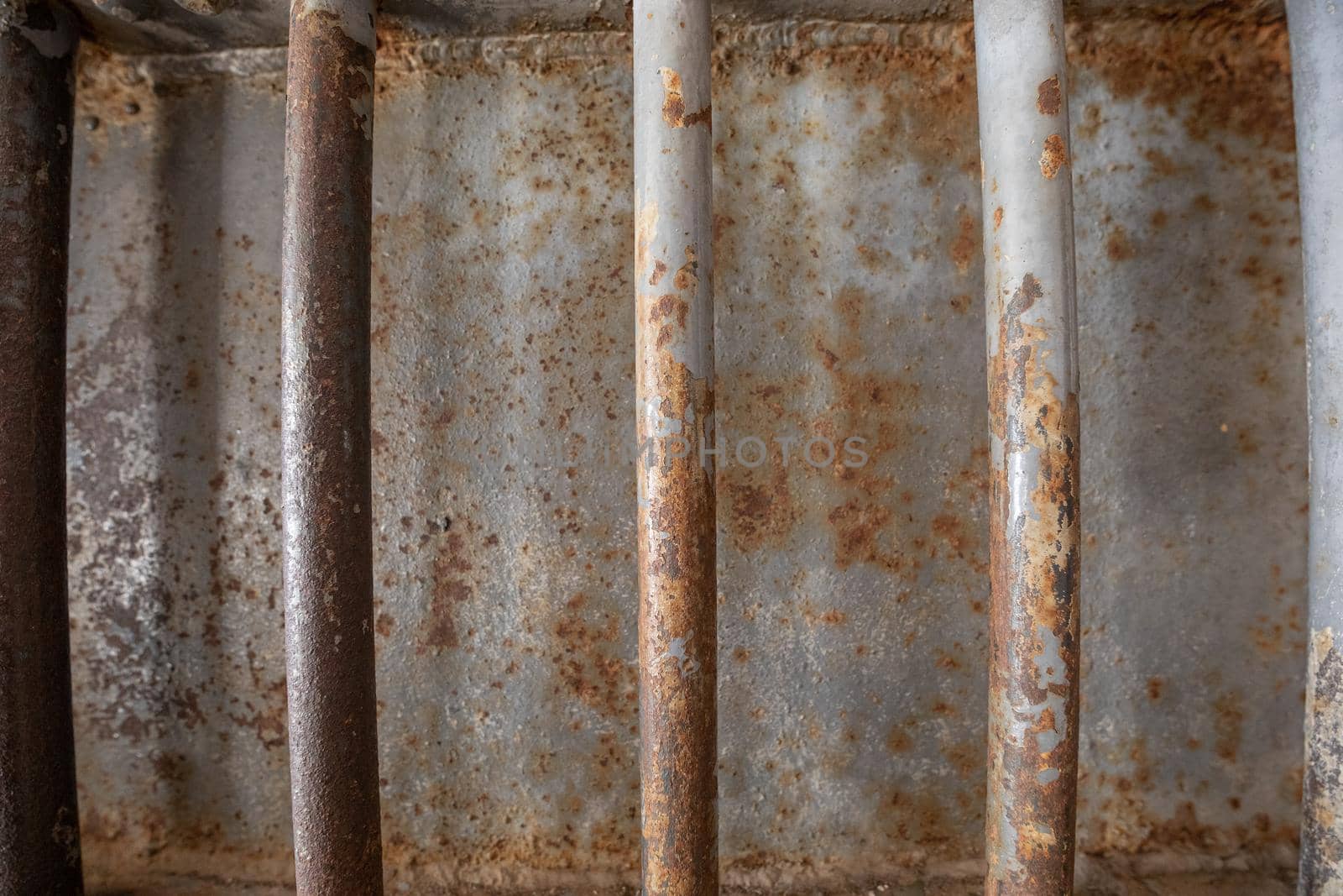 Rusted old iron bars designed to reinforce a door.