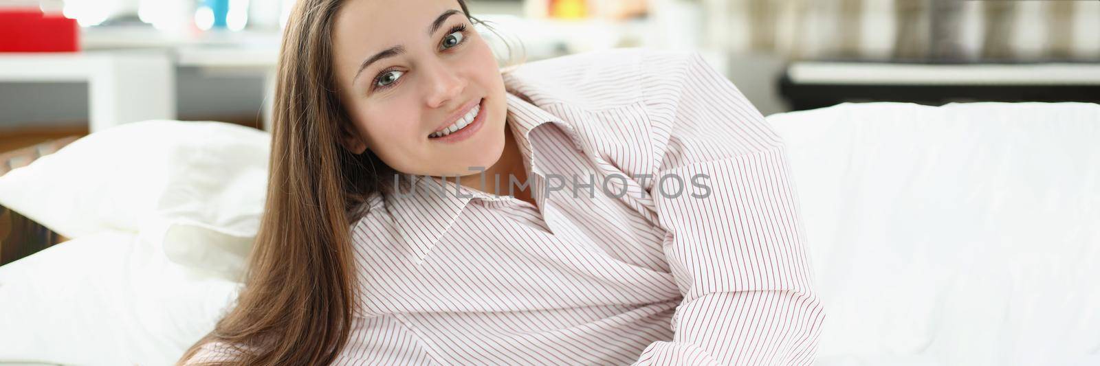 Portrait of happy well rested woman in pyjamas, wake up after peaceful night sleep, energized and cheerful. Good morning, start new day, wakeup, have good day concept