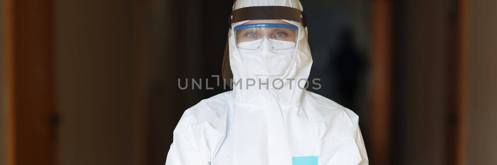 Portrait of medical worker in full protection uniform, woman work with coronavirus patients, take analysis and provide treatment. Virus spread, medicine, healthcare, save life concept