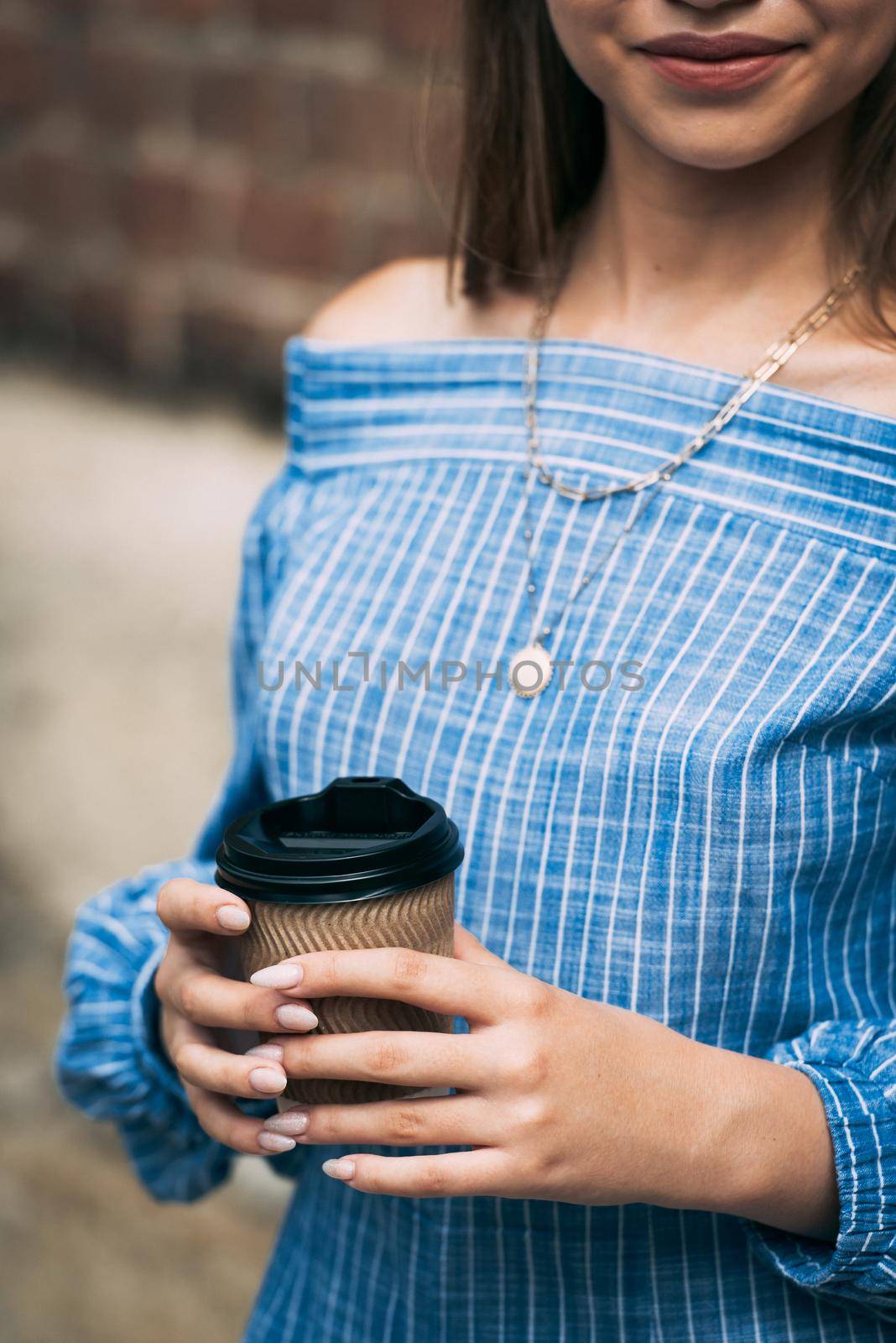 A female in a striped jumpsuit posing with a coffe cup by Ashtray25