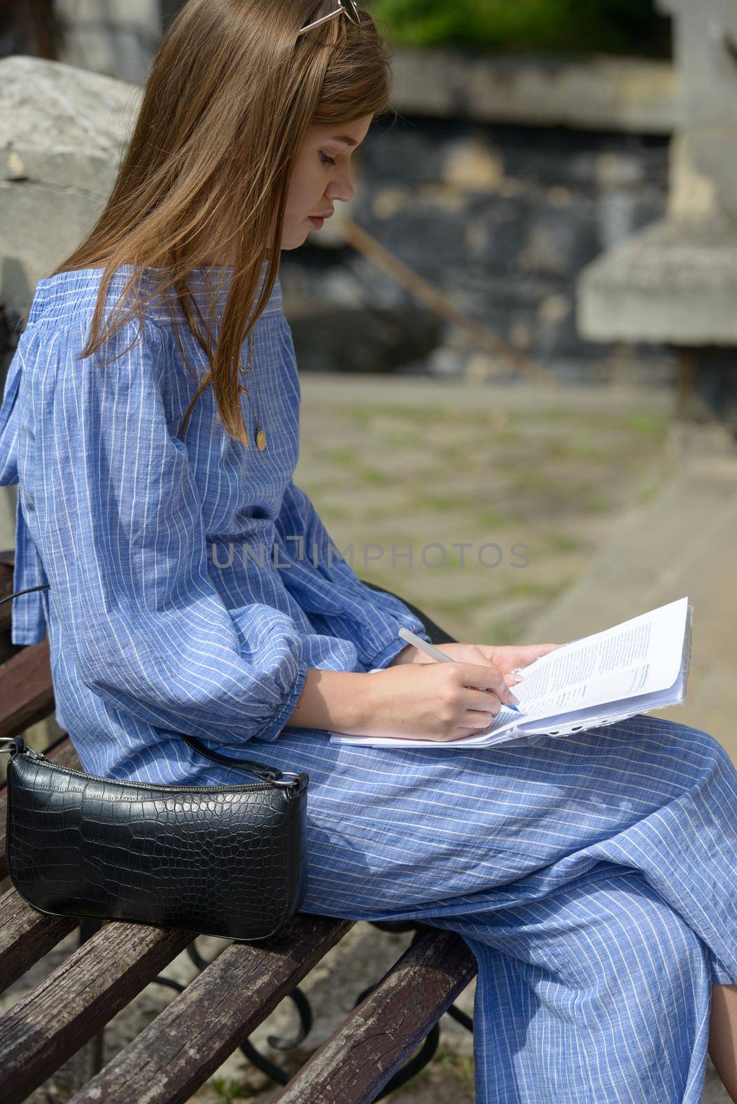 Female hand with pen completing personal information on form. Business woman signing profitable contract.