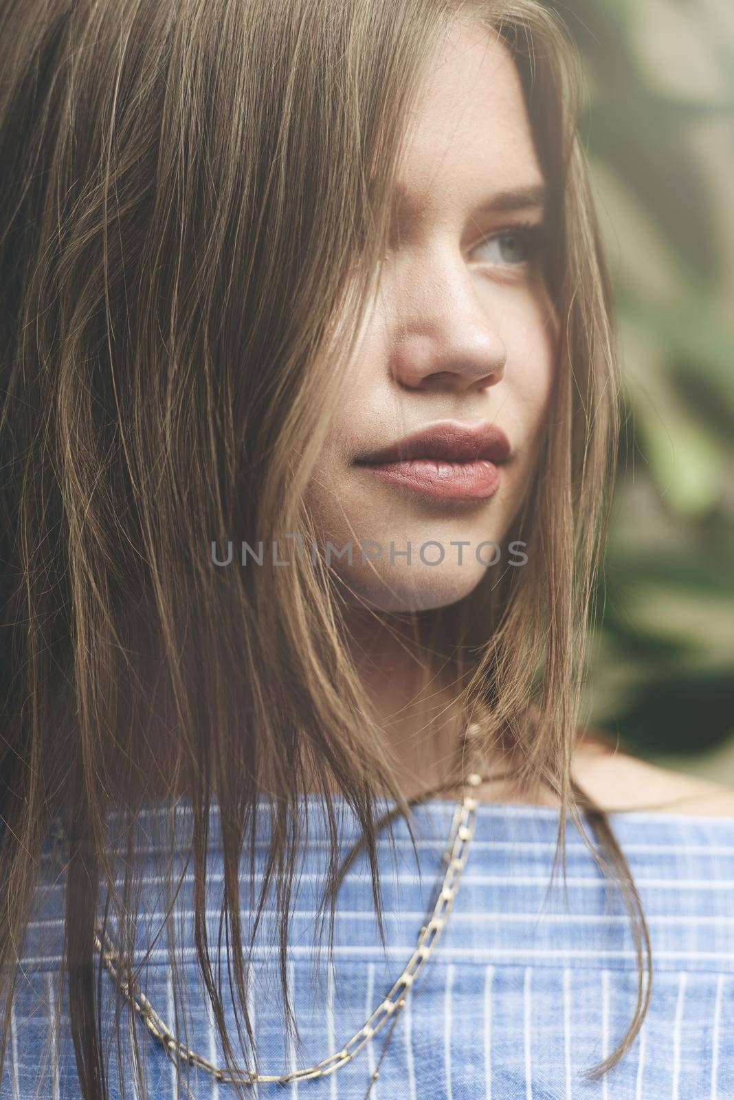 Close up fashion portrait of pretty girl, have long amazing brunette hairs.