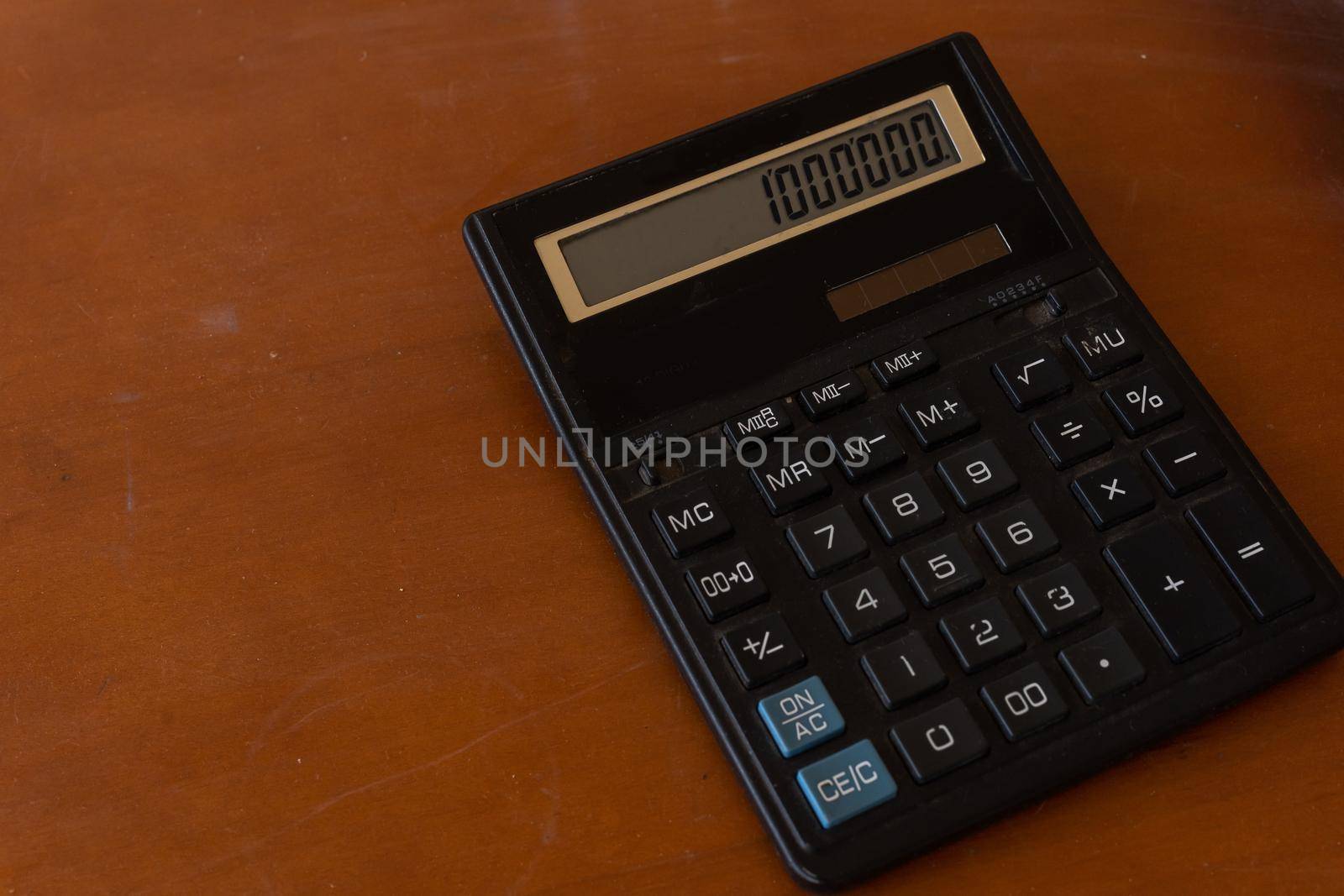 The Old calculator on wooden table by Andelov13