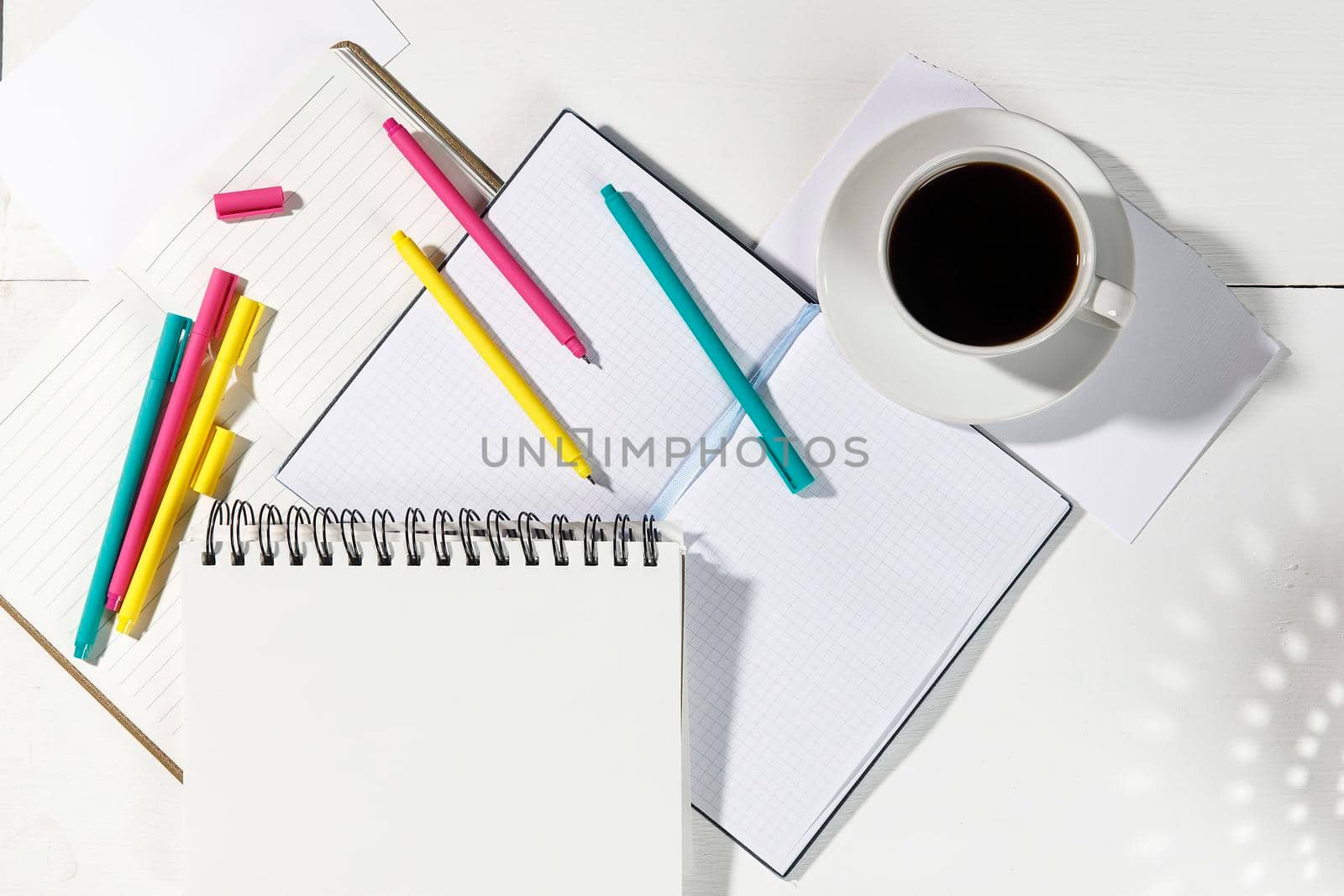 Layout for the office. Back to school. Blue notebook, colorful pens, felt-tip pens, paper clips. Place for text