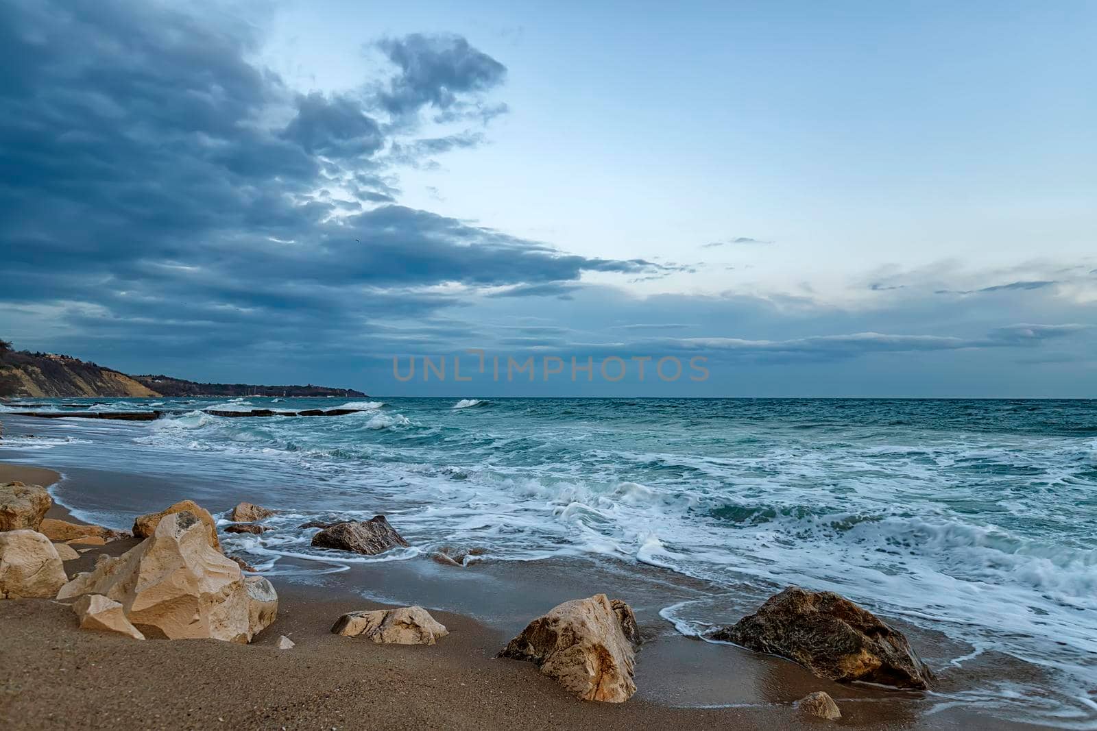 Beauty cloudy seascape with waves flowing between rocks. by EdVal