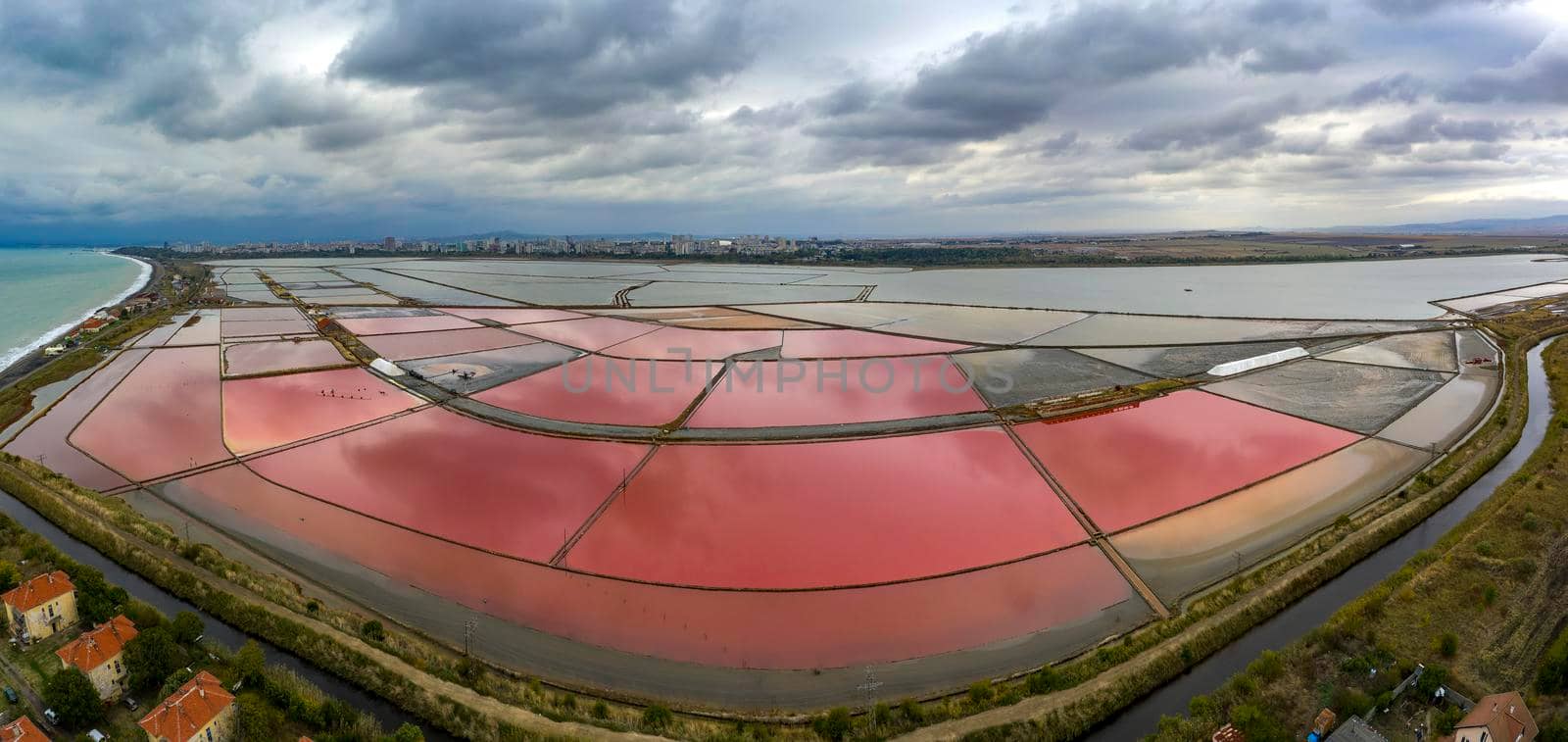 Panoramic aerial view of colorful salt pans near the sea. Burgas, Bulgaria by EdVal