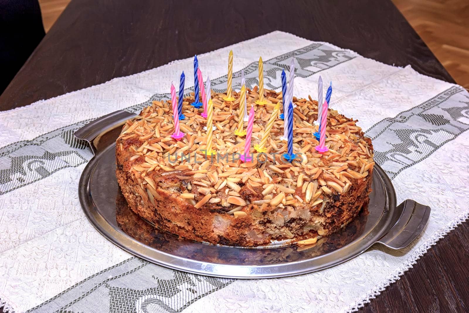 Delicious torte for birthday with candles on the table. by EdVal