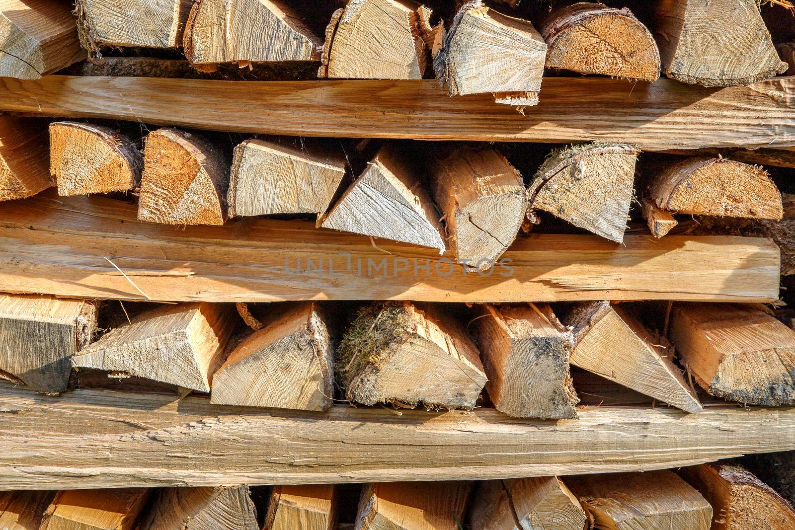 stacked dry wood for the fireplace. Close view by EdVal