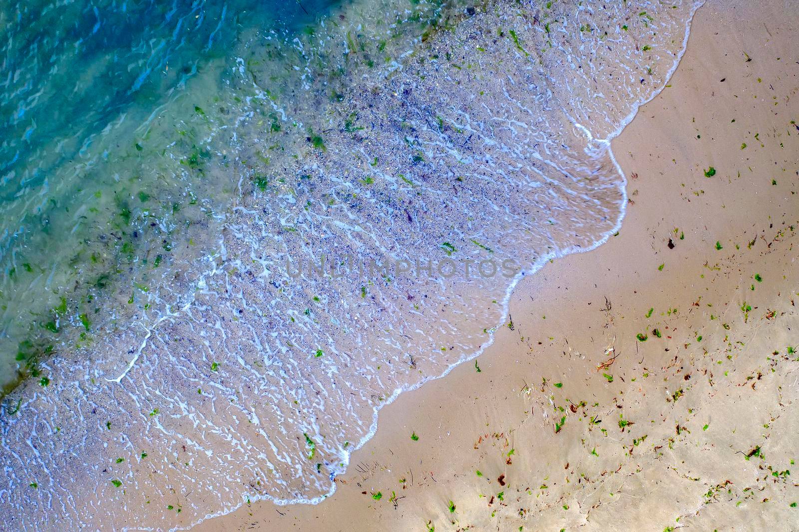 Aerial top view from drone to the seacoast with waves