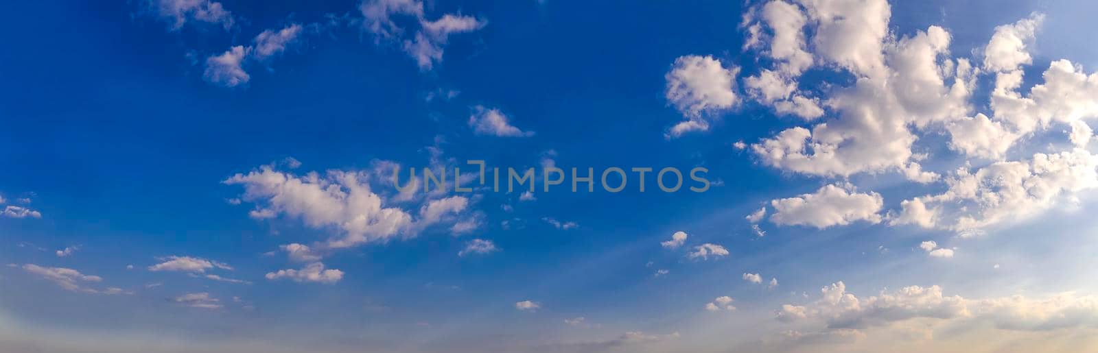 Scenic view of blue sky with fluffy clouds. Panorama